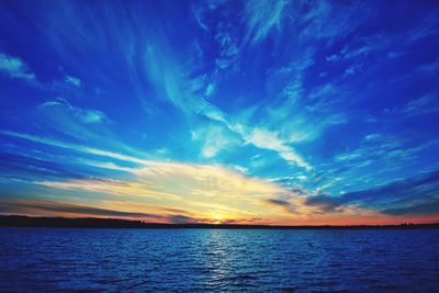 Scenic view of sea against sky at sunset