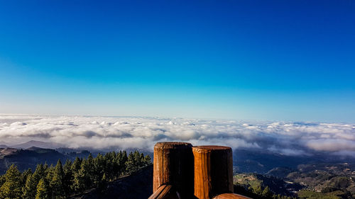 Scenic view of mountains against blue sky