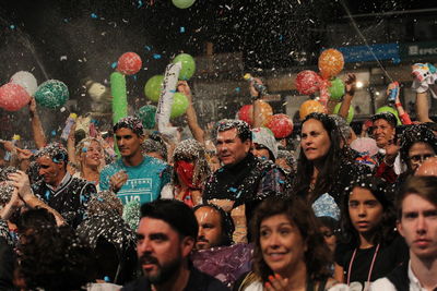 Portrait of happy friends during festival