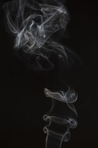 Close-up of smoke against black background