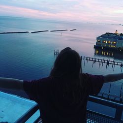 Rear view of woman looking at sea