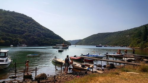 Boats moored in lake