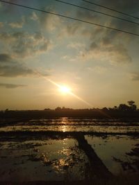 Scenic view of sunset over water