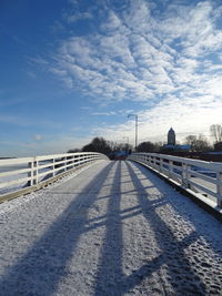 Road passing through snow covered landscape