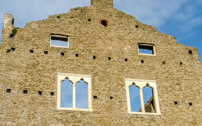 Low angle view of old building against sky