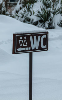 Close-up of road sign on snow