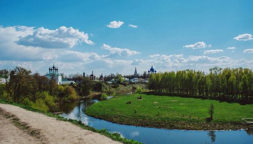 Scenic view of landscape against cloudy sky