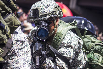 Close-up of soldier with gun