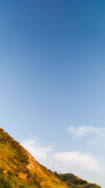 Scenic view of landscape against blue sky