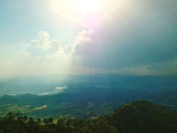 Aerial view of river with mountain range in background
