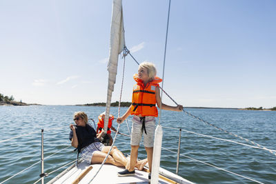 Mother with children on boat