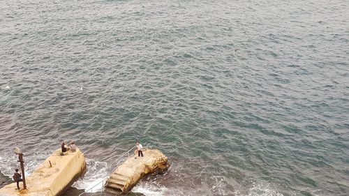 High angle view of rocks in sea