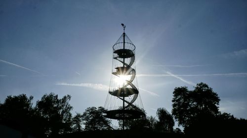 Low angle view of silhouette trees against sky
