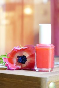 Close-up of flower in glass on table