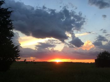 Scenic view of landscape against cloudy sky