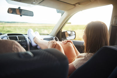 Woman relaxing in car