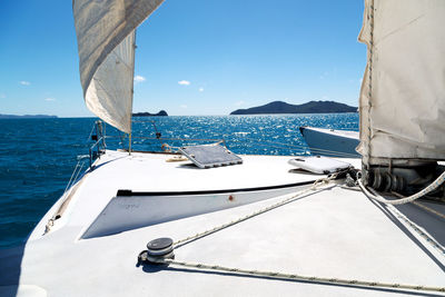 Sailboat sailing in sea against sky