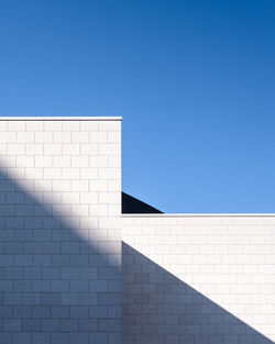 Low angle view of building against clear blue sky