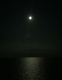 Scenic view of sea against sky at night
