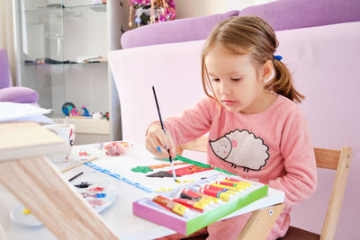 Girl painting at home