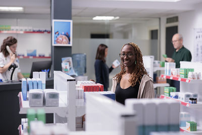 Portrait of young woman working at office