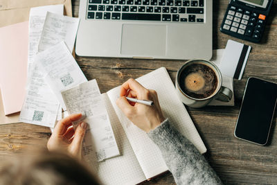 A female accountant considers the family budget and expenses.