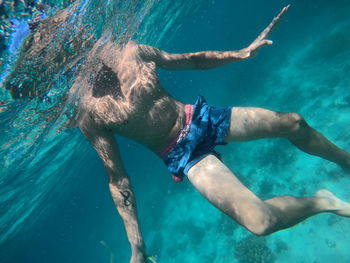 Man swimming in sea