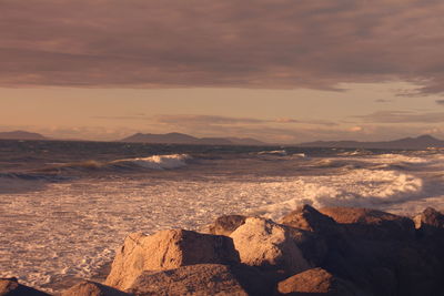 Scenic view of landscape against sky during sunset