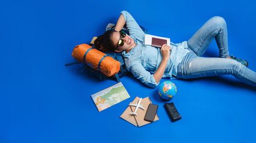 High angle view of young woman lying down