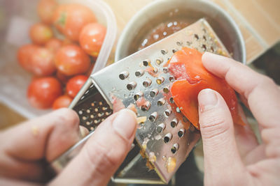 Cropped image of person holding ice cream