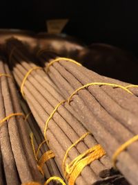 Close-up of yellow leaf on wood at night