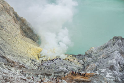 Aerial view of people on volcanic landscape