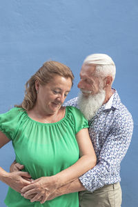 Man and woman standing outdoors