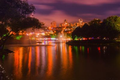 Scenic view of lake against sky at night