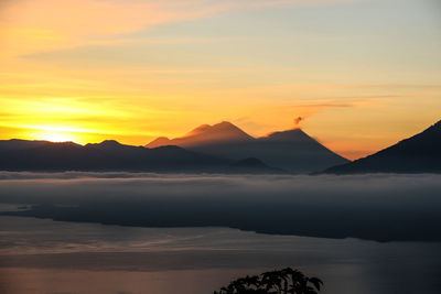 Scenic view of mountains against sky during sunset