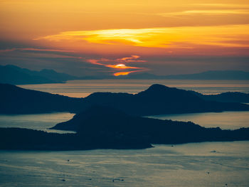 Scenic view of silhouette mountains against sky during sunset