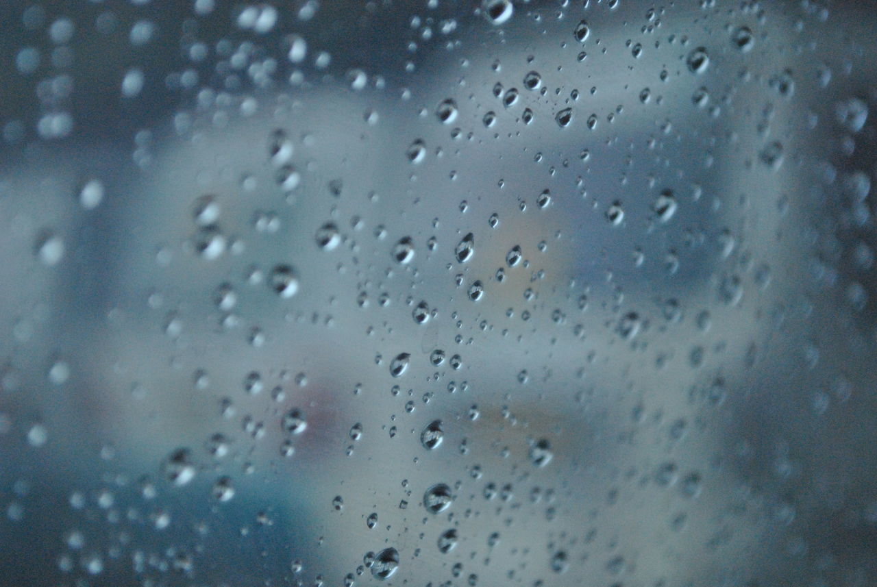 RAINDROPS ON GLASS WINDOW