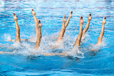 Low section of people in swimming pool