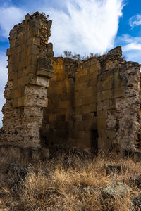 Low angle view of old ruins against sky