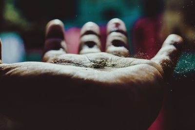 Cropped hand of person with dust