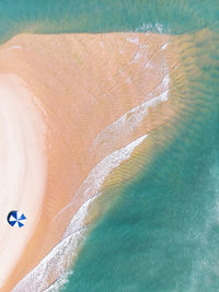 High angle view of surf on the beach