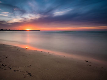 Scenic view of sea against dramatic sky