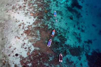 High angle view of people swimming in sea