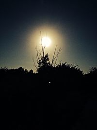 Silhouette of trees against sky at sunset