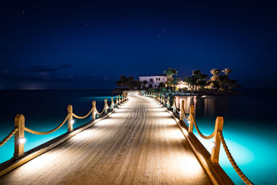 View of swimming pool at night