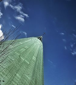 Low angle view of building against blue sky