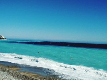 View of beach against blue sky