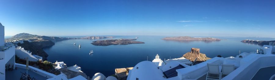 Panoramic view of sea against buildings