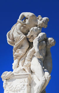 Low angle view of statue against clear blue sky