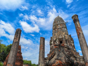 Low angle view of old temple building against sky